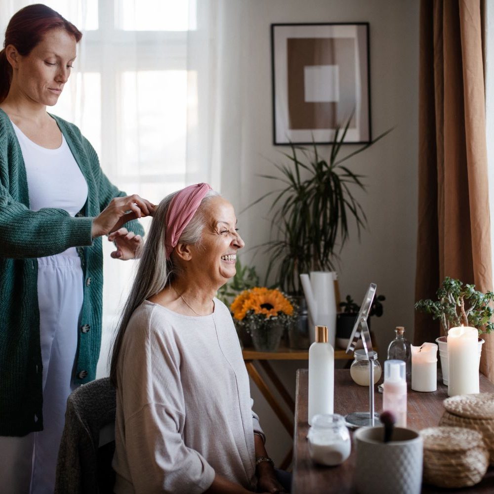 caregiver-helping-her-client-with-a-hairstyle-2023-11-27-05-20-33-utc_ok